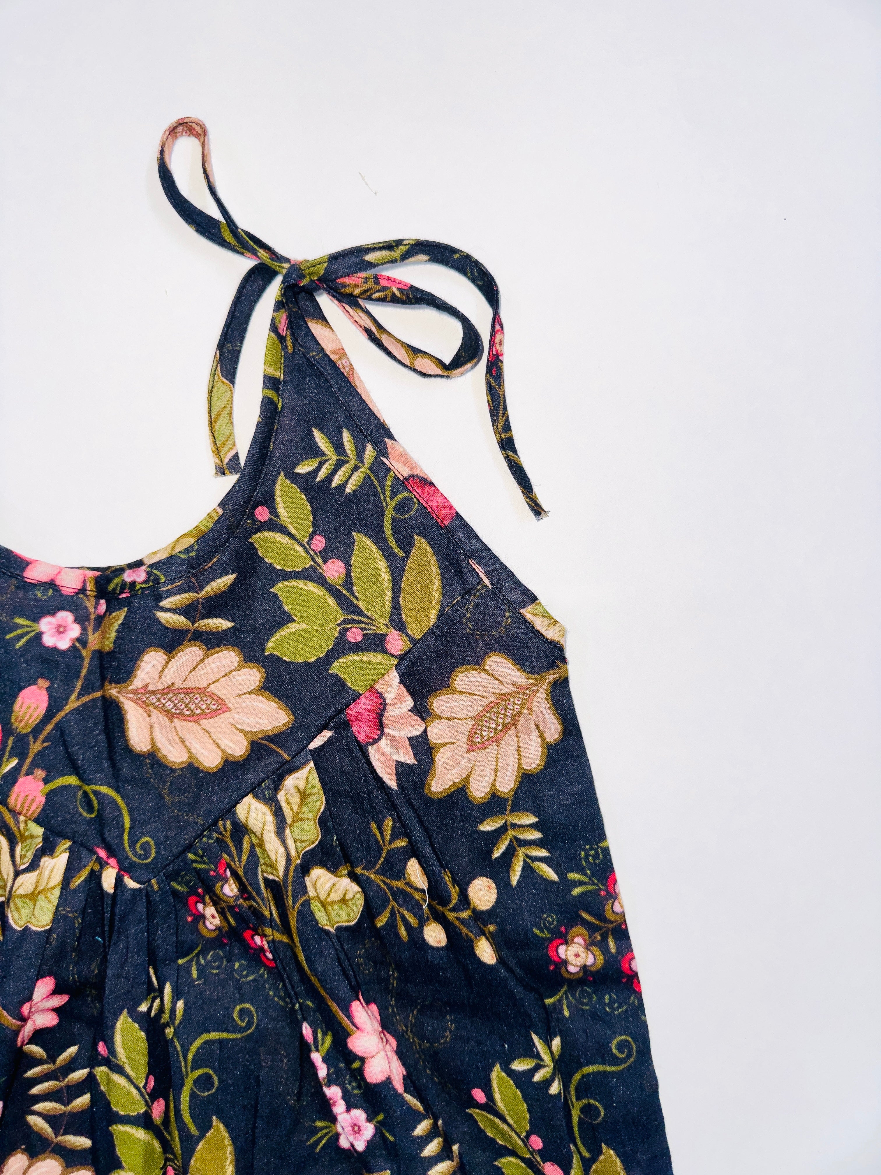 Midnight Bloom Tie-Up Romper for Girls with Black Base and Floral Patterns