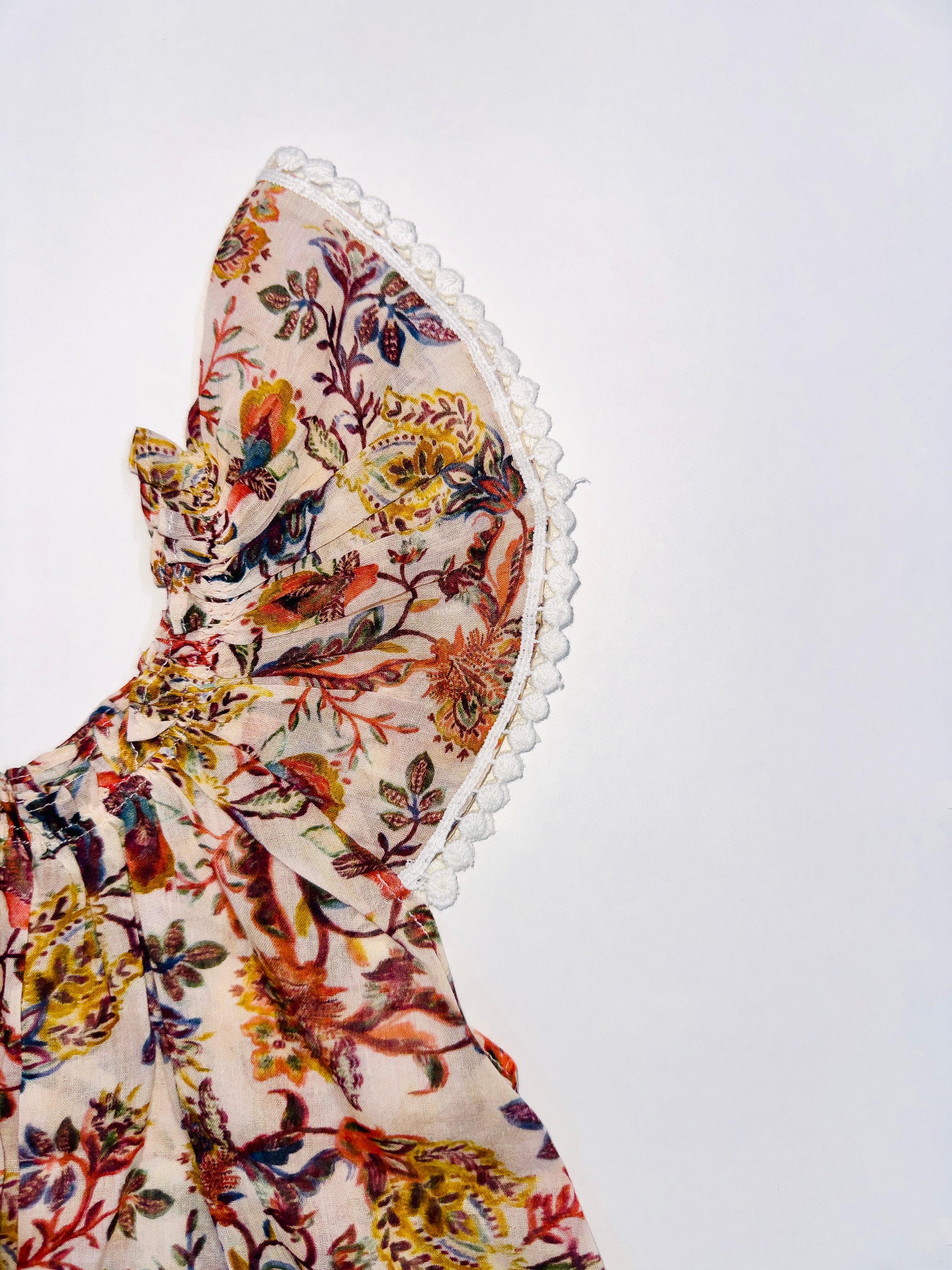 Golden Blossom Frock for Girls with Floral Designs, Lace Sleeves, and Breathable Fabric.