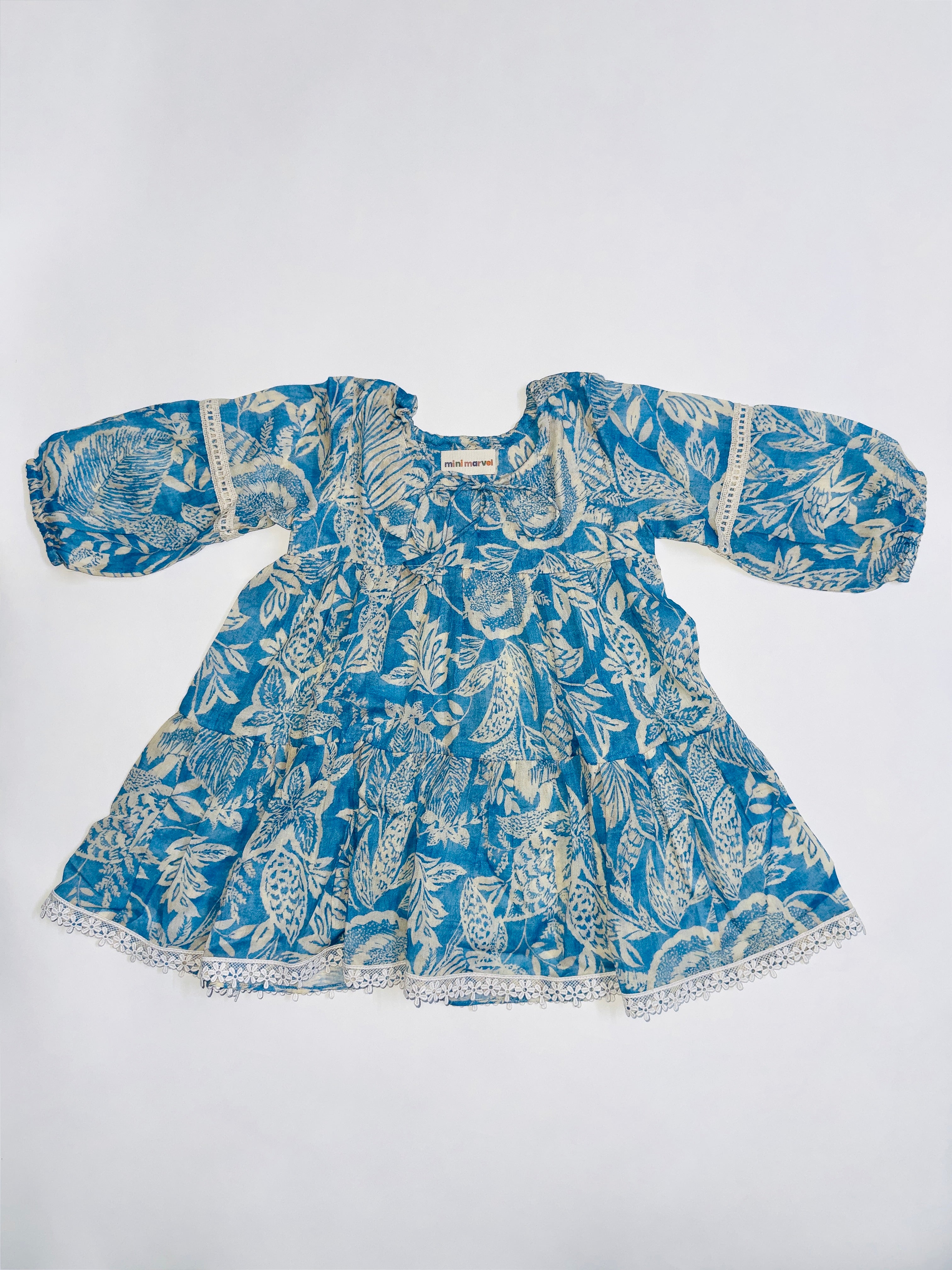 Ocean Dream Dress for Girls with Blue Ocean-Inspired Print and Lace Details.
