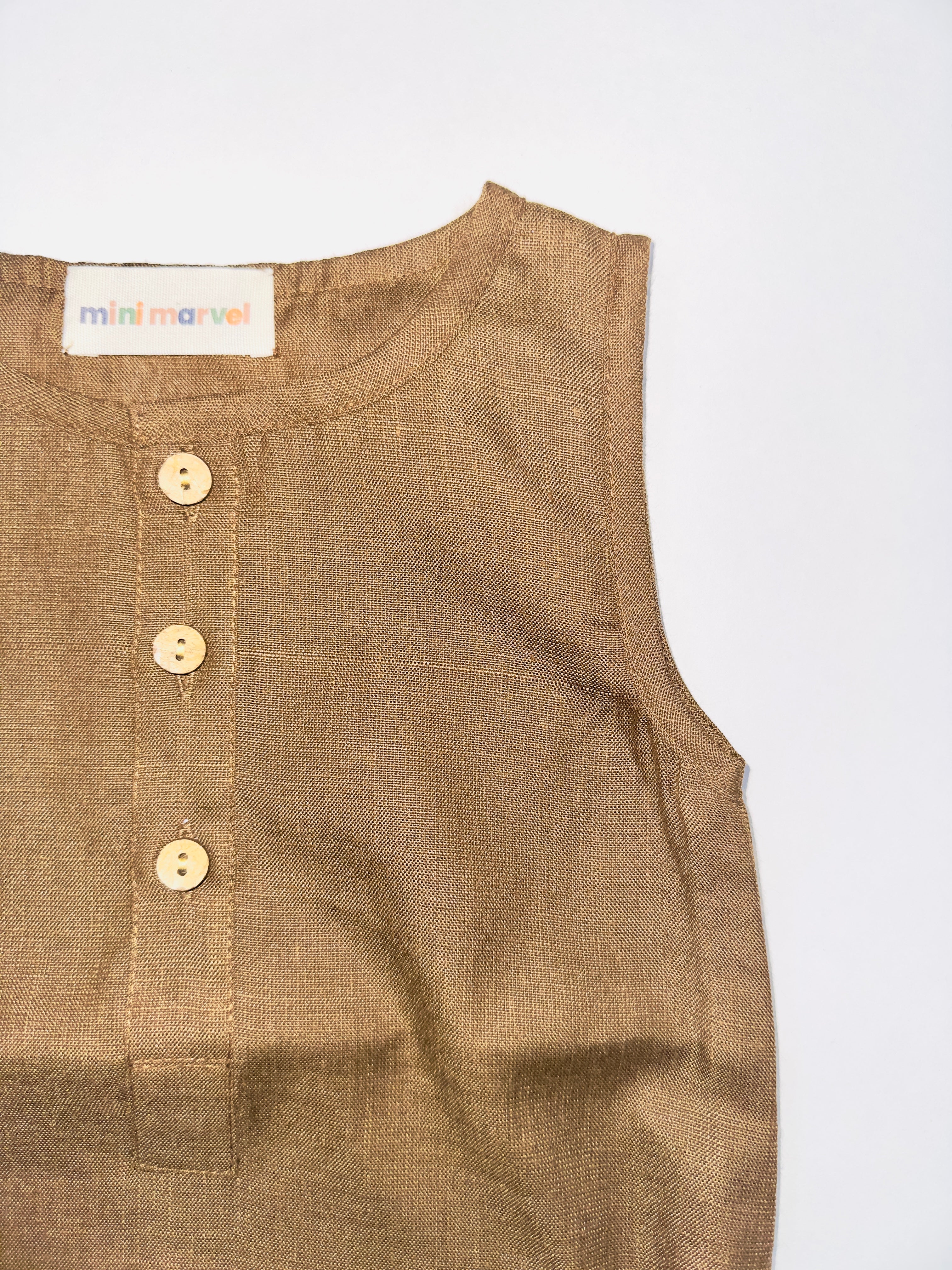 Brown Baby Romper with Wooden Buttons and Snap Closures for Newborns.