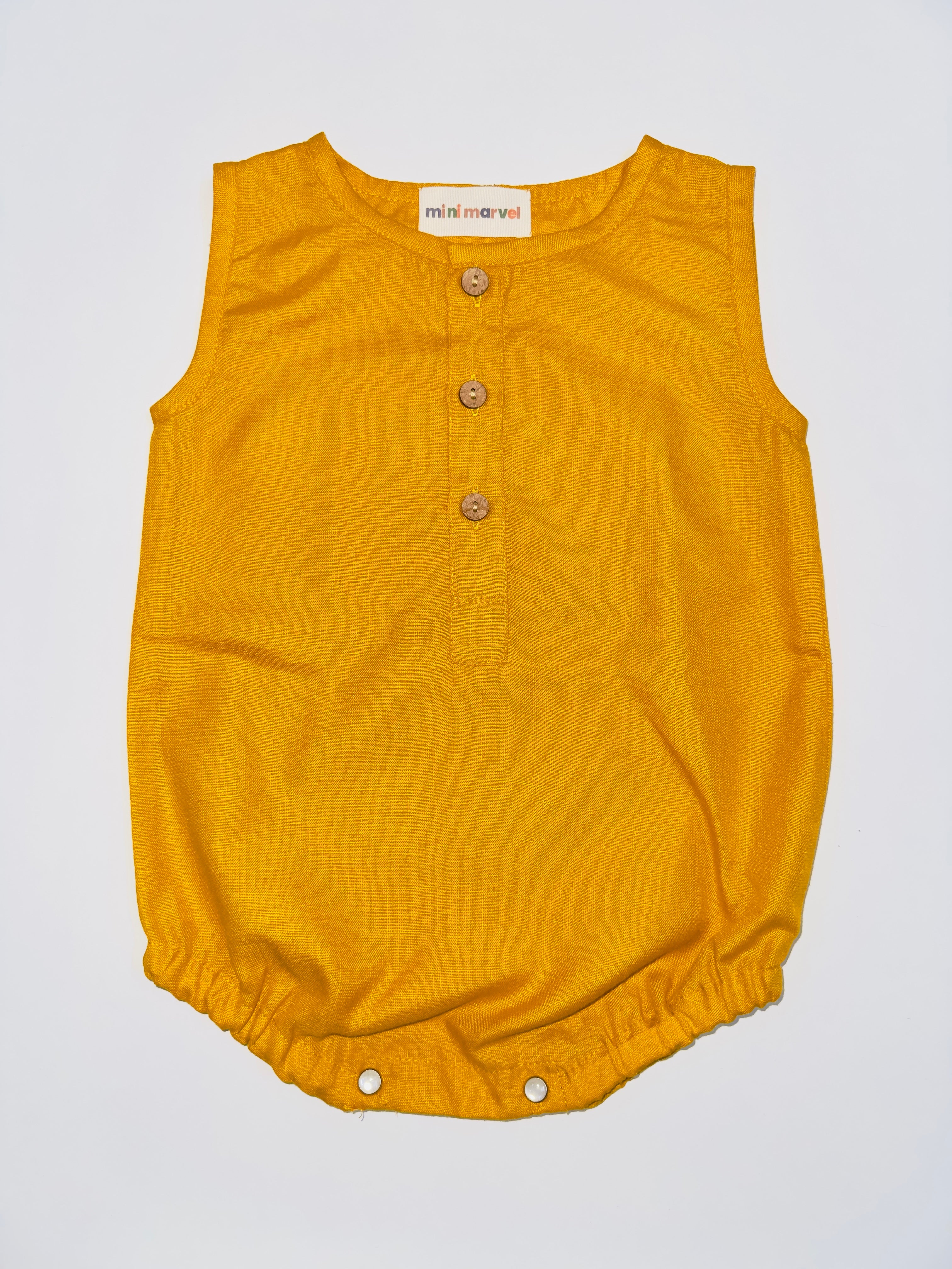 Classic Mustard Buttoned Baby Romper with Wooden Buttons and Snap Closures.