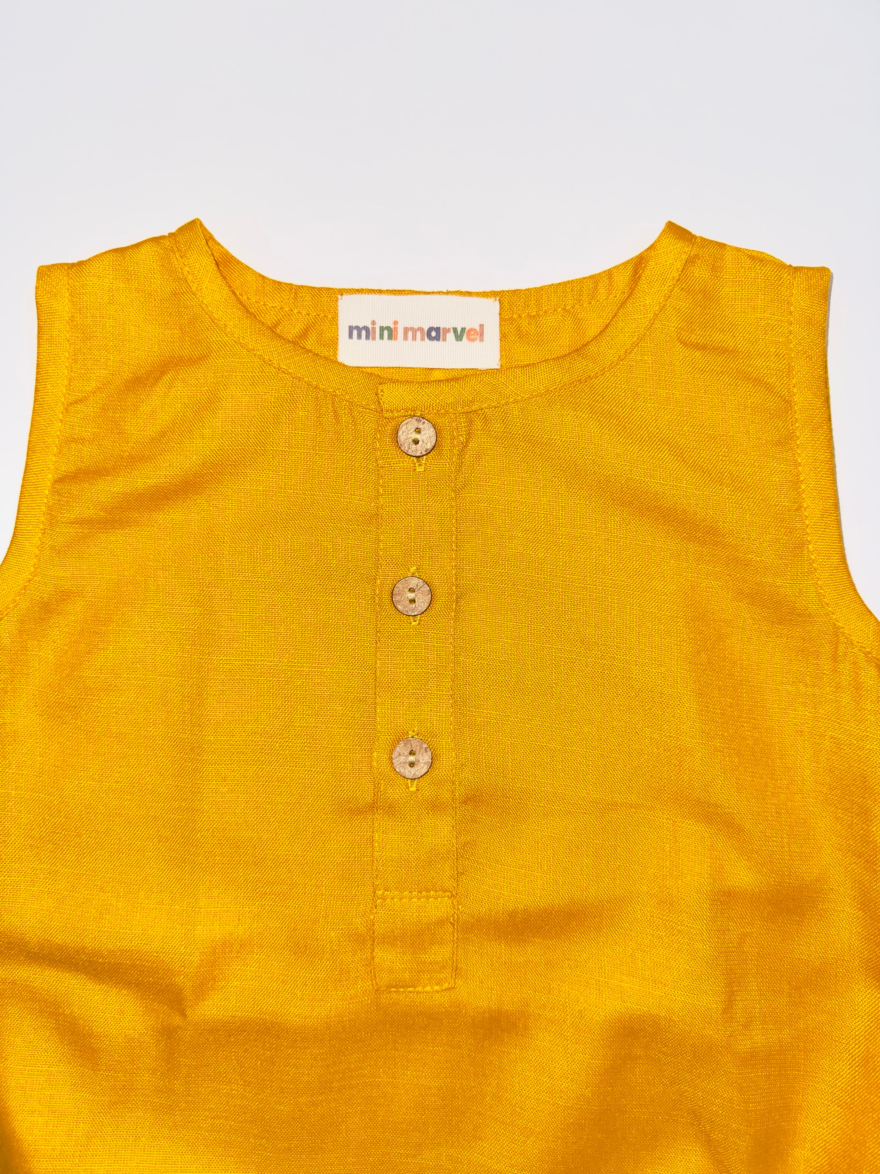 Classic Mustard Buttoned Baby Romper with Wooden Buttons and Snap Closures.