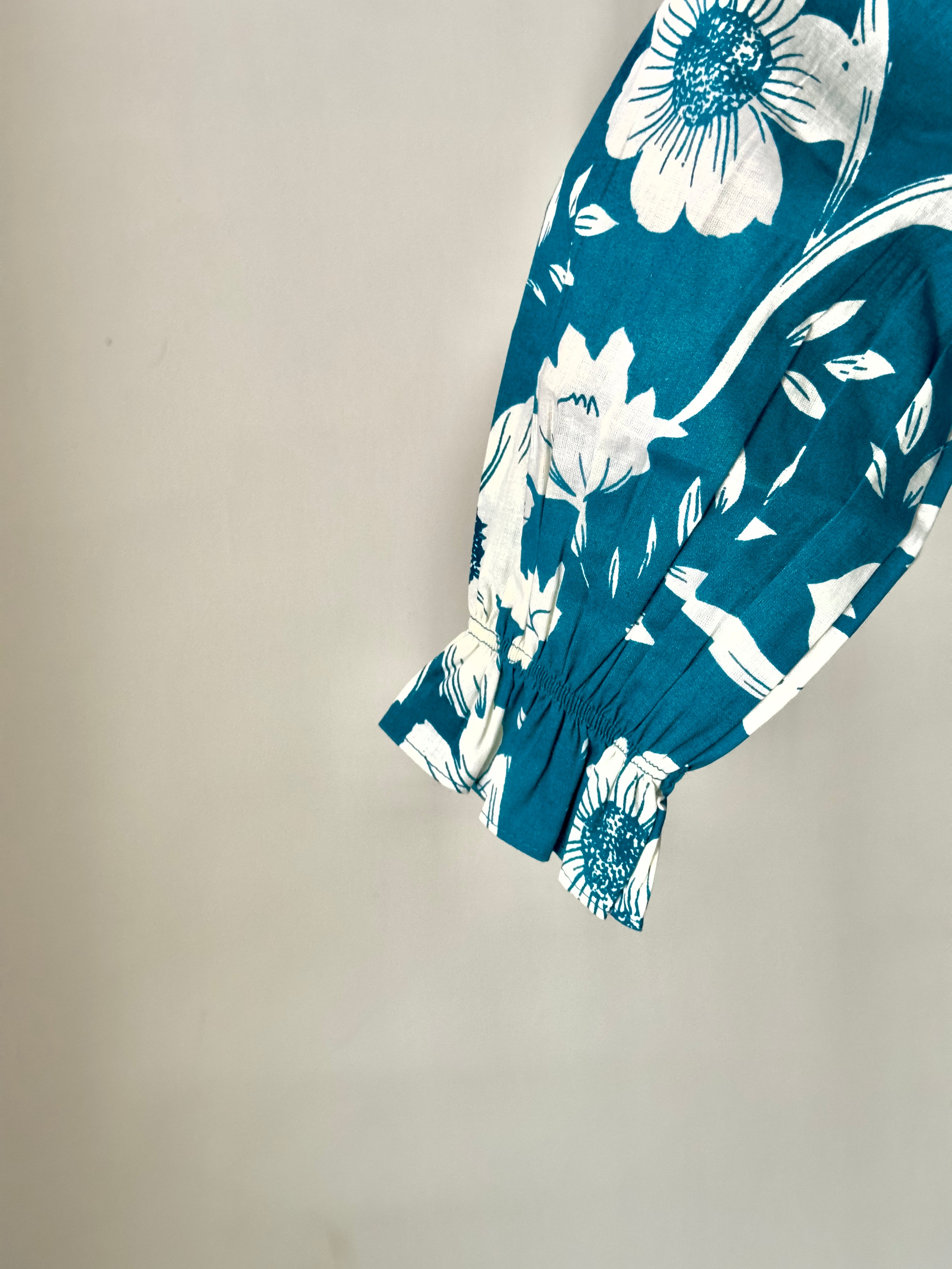 Baby girl floral Peter Pan dress in teal cotton