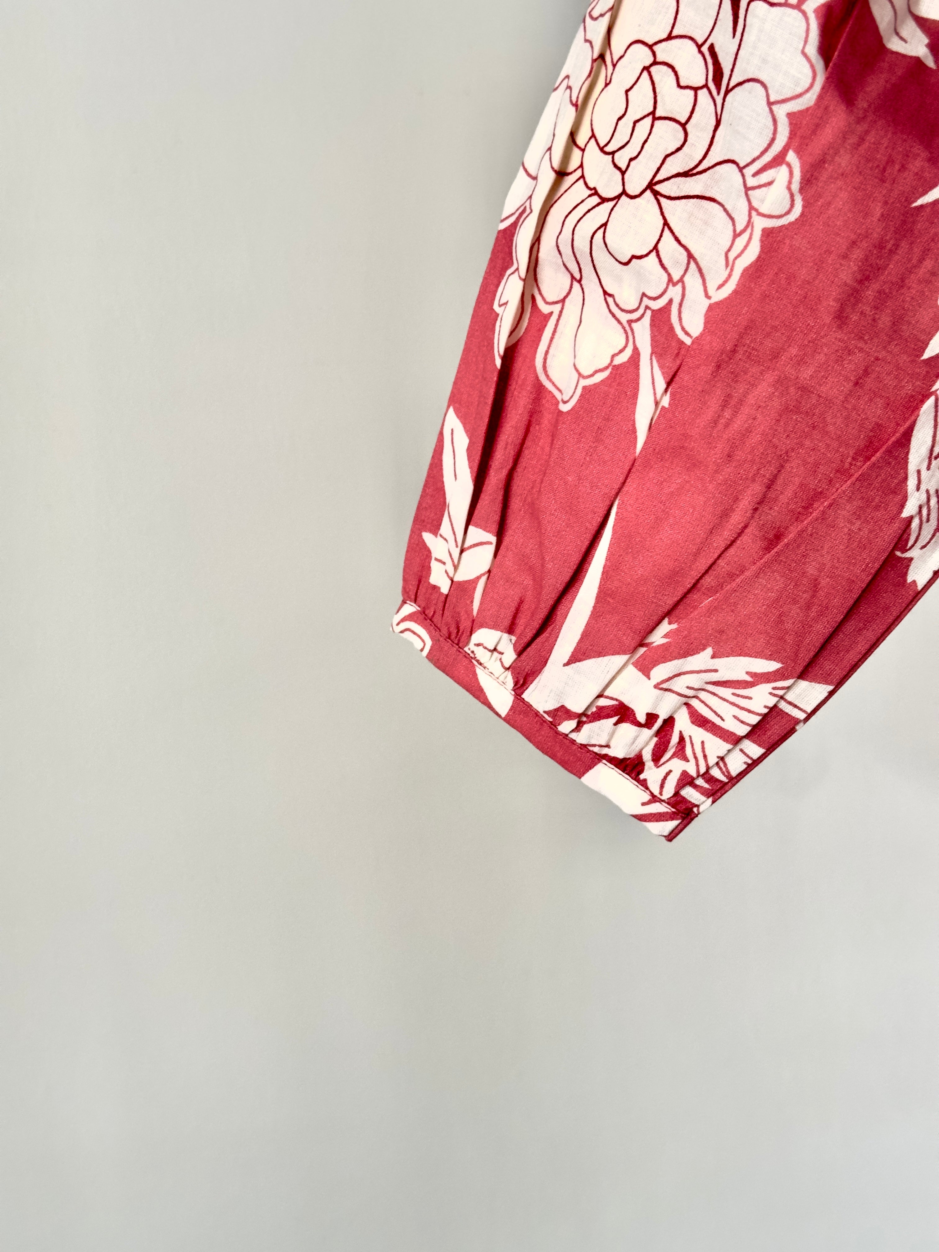 Girls floral top paired with cream cotton bottoms