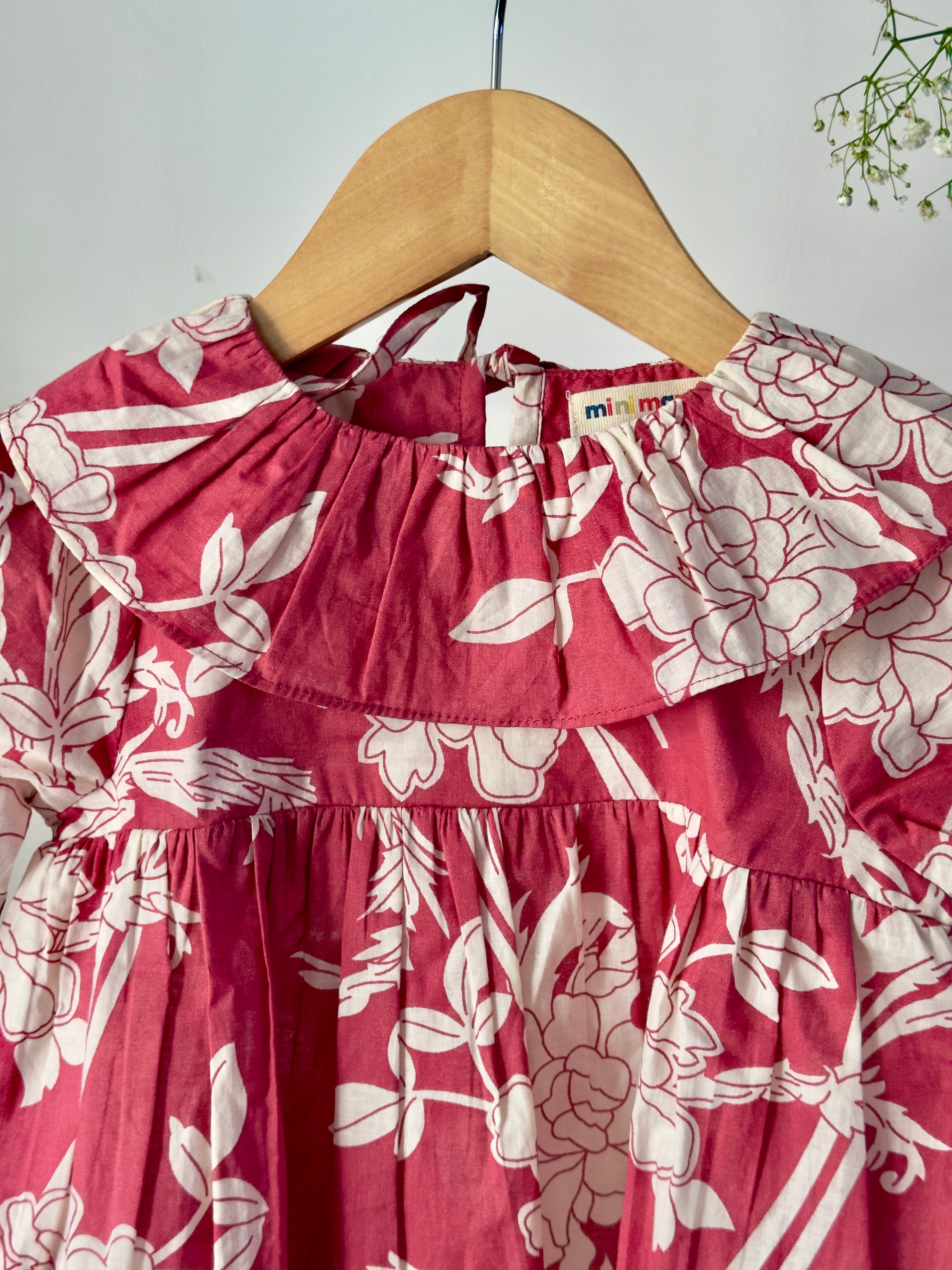 Girls floral top paired with cream cotton bottoms