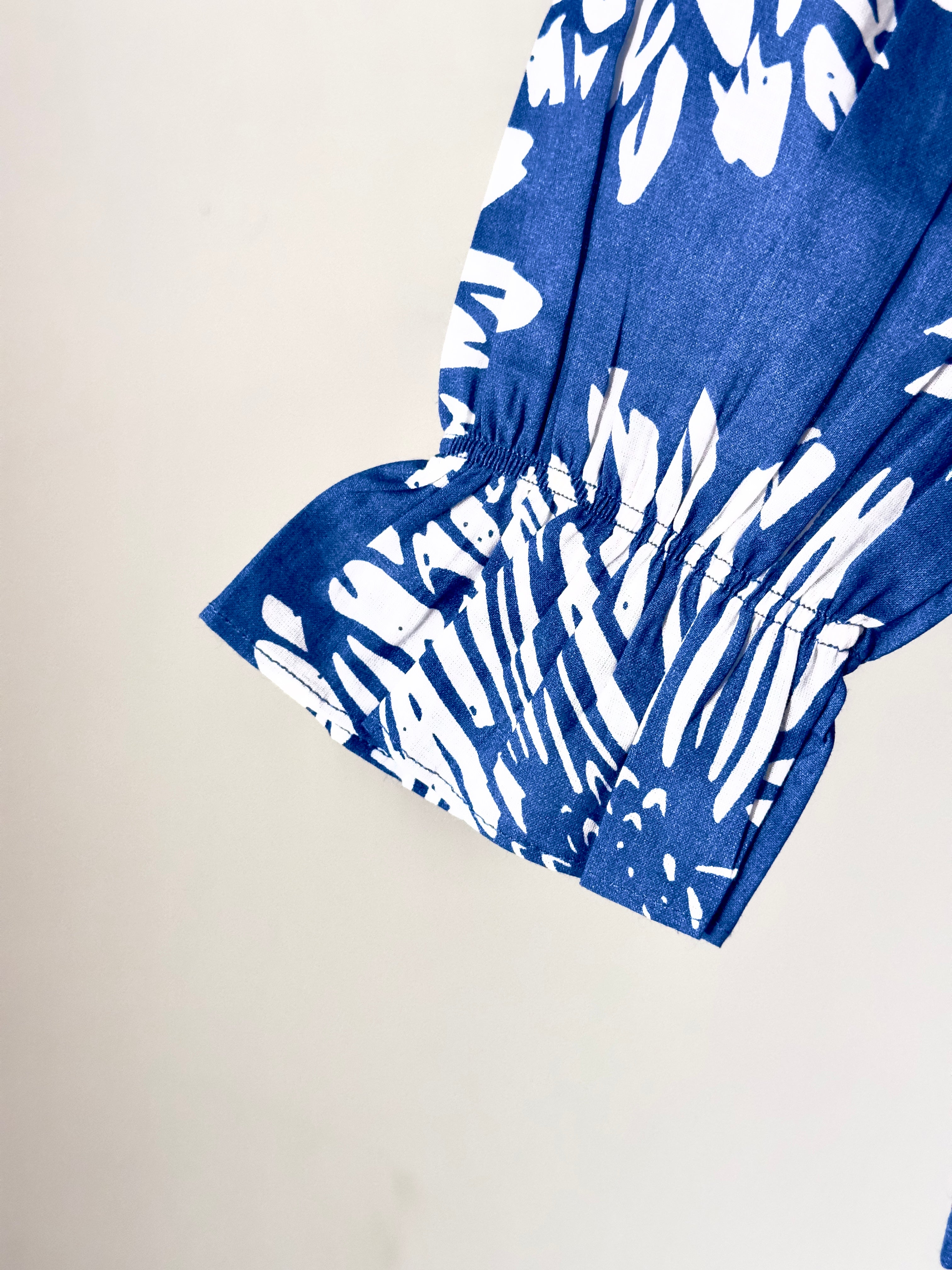 Blue and white patterned fabric on a beige background

Baby girl matching outfit set in blue and cream