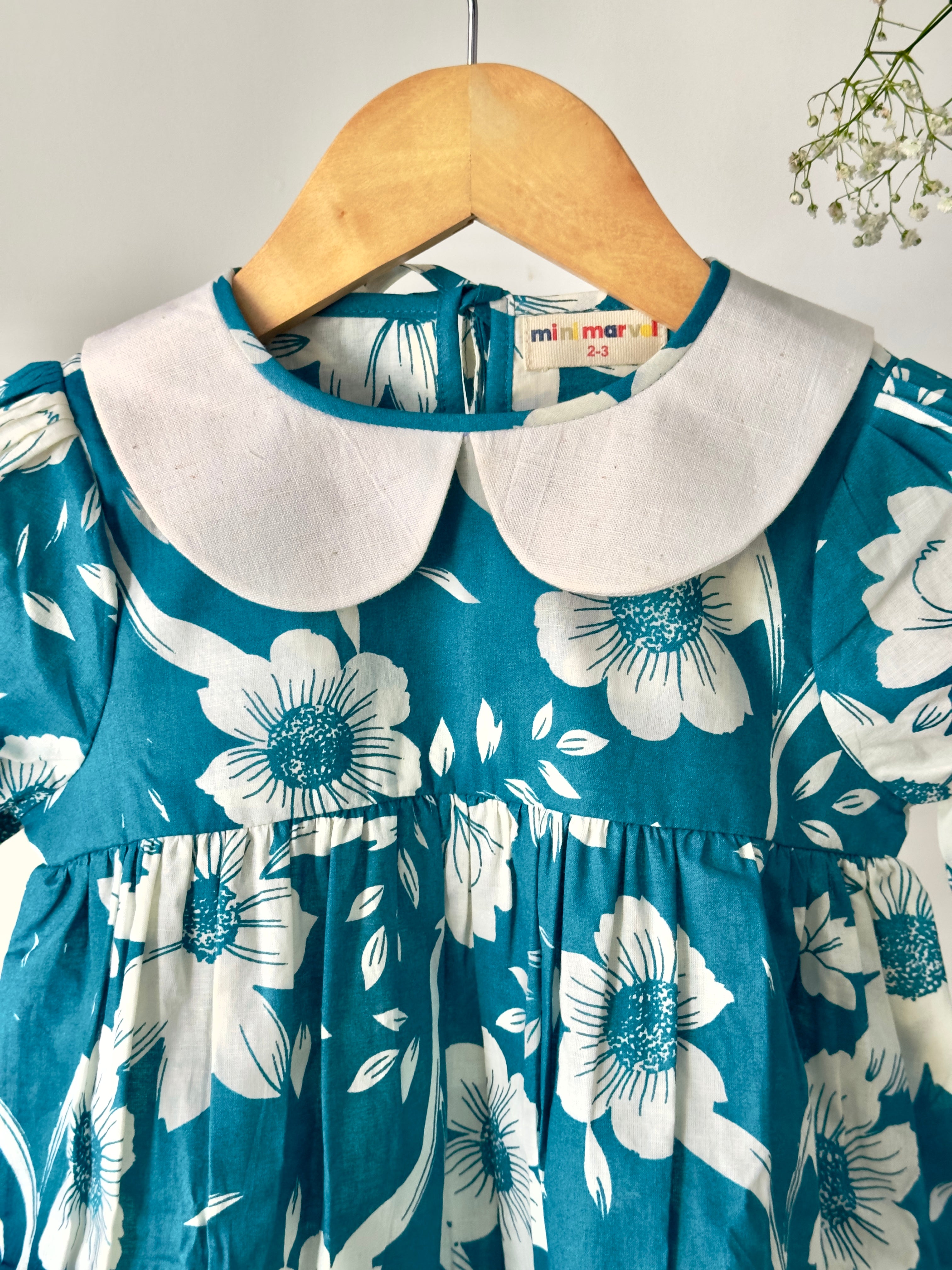 Baby girl floral Peter Pan dress in teal cotton