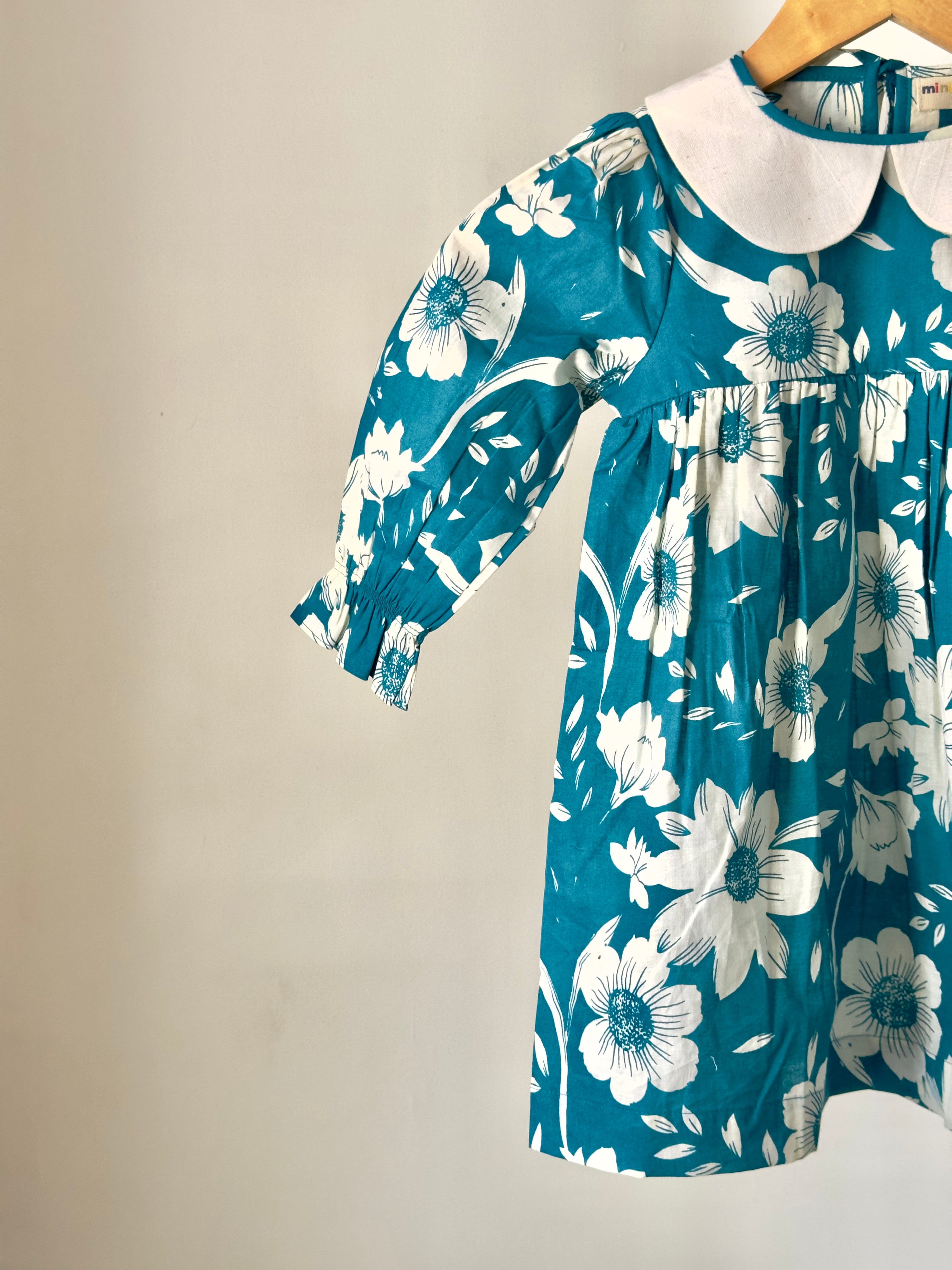 Baby girl floral Peter Pan dress in teal cotton