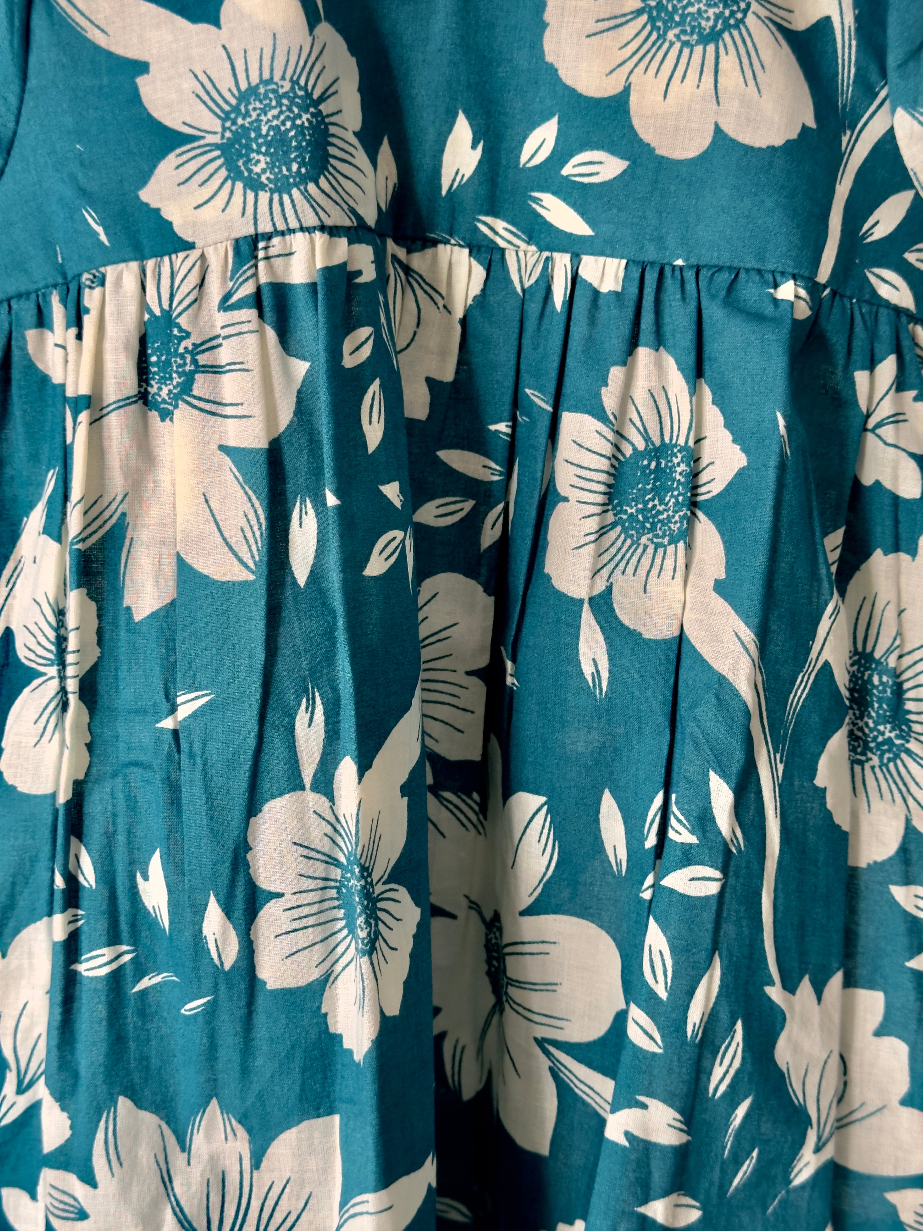 Baby girl floral Peter Pan dress in teal cotton